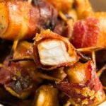 A close up of bacon wrapped chicken