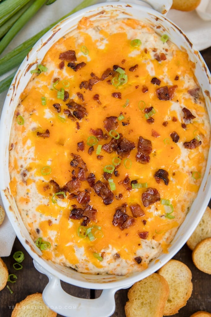 Chicken + Bacon + Ranch + Cheese = a creamy and indulgent Chicken Crack Dip. Highly addictive and the perfect party appetizer.