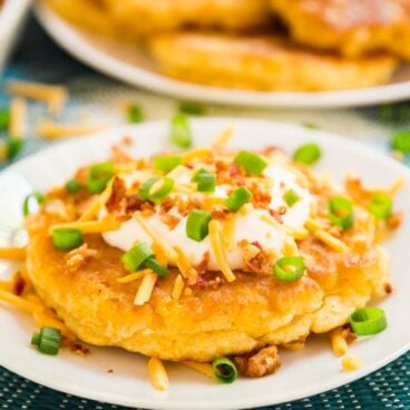Loaded Corn Fritters are a light and fluffy corn cake topped with all the fixings to make this the a killer game day snack!