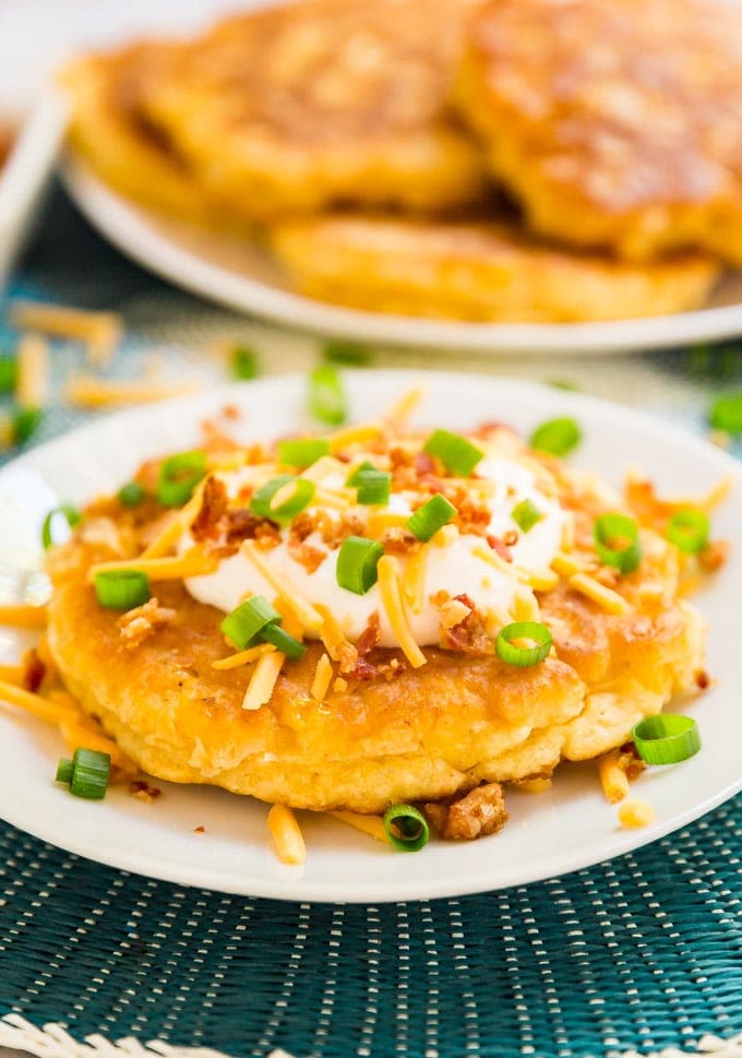 Loaded Corn Fritters are a light and fluffy corn cake topped with all the fixings to make this the a killer game day snack!