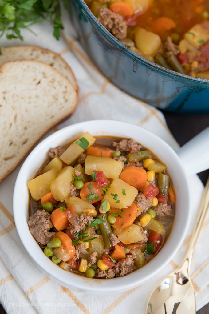 Smoky Vegetable Beef Soup is a simple dinner made in one pot, with a tomato beef broth, ground beef and tons of vegetables. A bowl of Smoky Vegetable Beef Soup