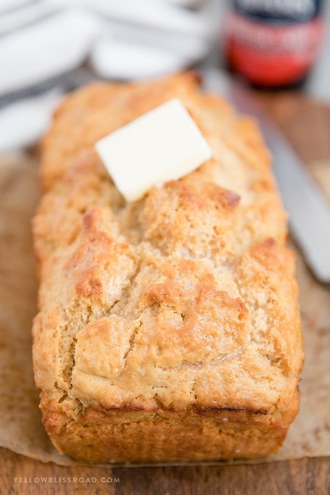 A loaf of easy beef bread with a pat of butter on top.