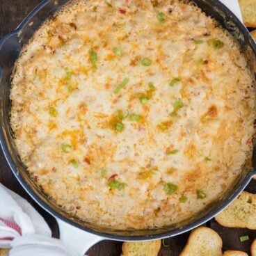 A pan filled with cheesy baked shrimp dip