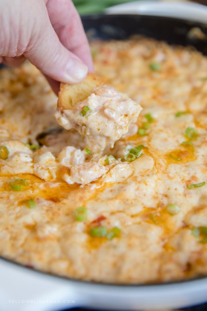 Baked shrimp dip on a piece of toasted bread.