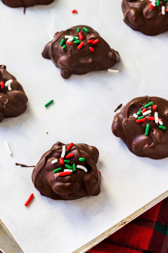 Crockpot candies on a baking sheet hardening. 