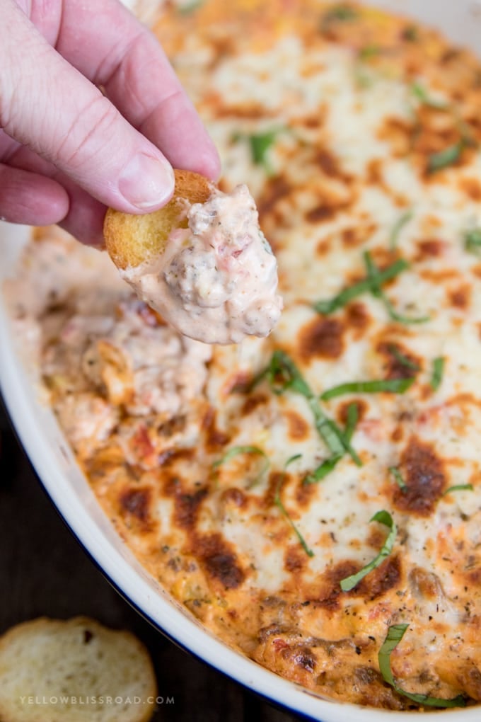 Spicy Italian Sausage Dip on a piece of crostini.