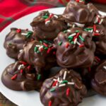 Chocolate Crockpot Candy on a white plate.