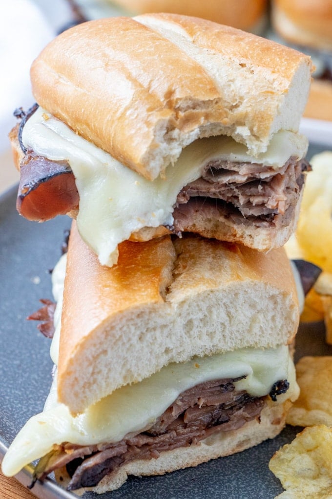 French Dip Sandwich halves stacked on top of each other.