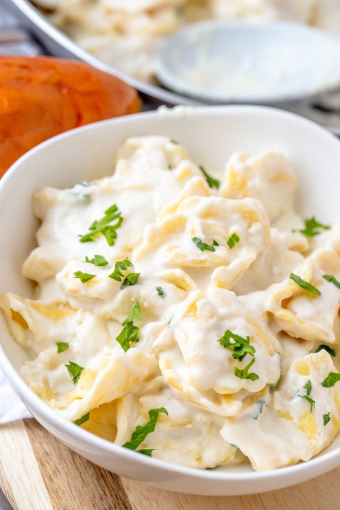 Garlic Parmesan Tortellini in a white bowl.