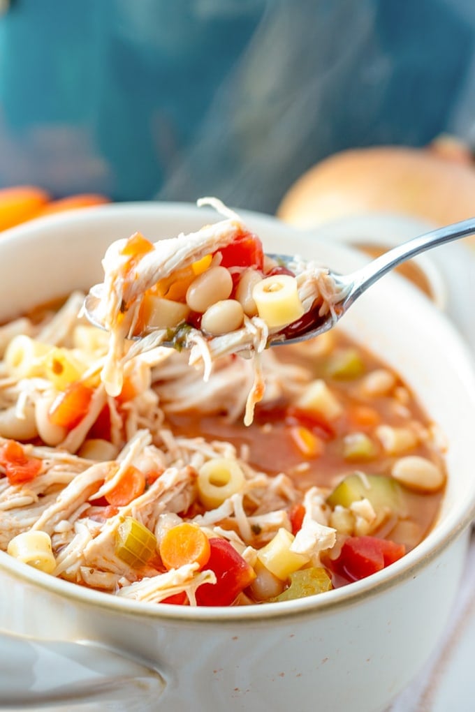 30 Minute Chicken Minestrone Soup in a bowl with a spoon.