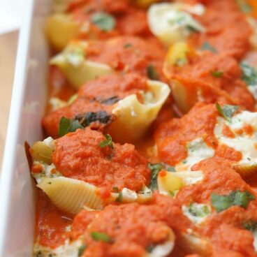 close up of stuffed shells in a pan after baking