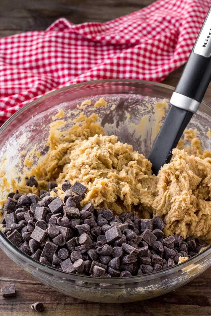 A bowl of cookie dough for making chocolate chip cookie bars. 