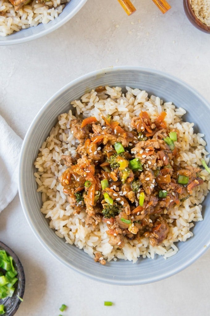 This Ground Turkey Recipe with Teriyaki Sauce and veggies on top of a big bowl of steamed rice makes these Teriyaki Turkey Rice Bowls a family favorite! bowl with lean ground turkey, rice and vegetables