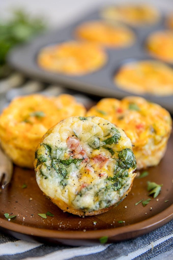 Baked egg muffins cups in a variety of flavors. A plate of baked Egg Muffins
