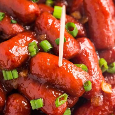 A close up image of BBQ Little Smokies with a tooth pick