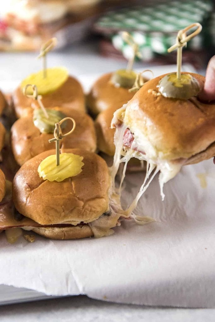 Cuban Pork Belly Sliders with a cheese pull.