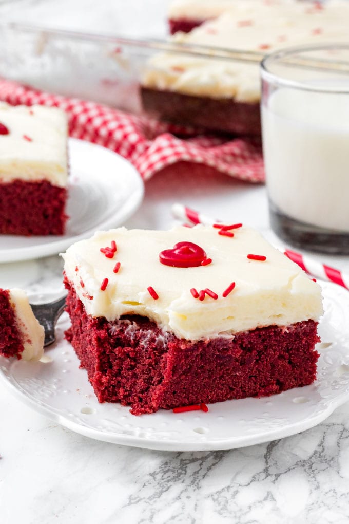 Fudgy red velvet brownie with a bite taken out of it. 