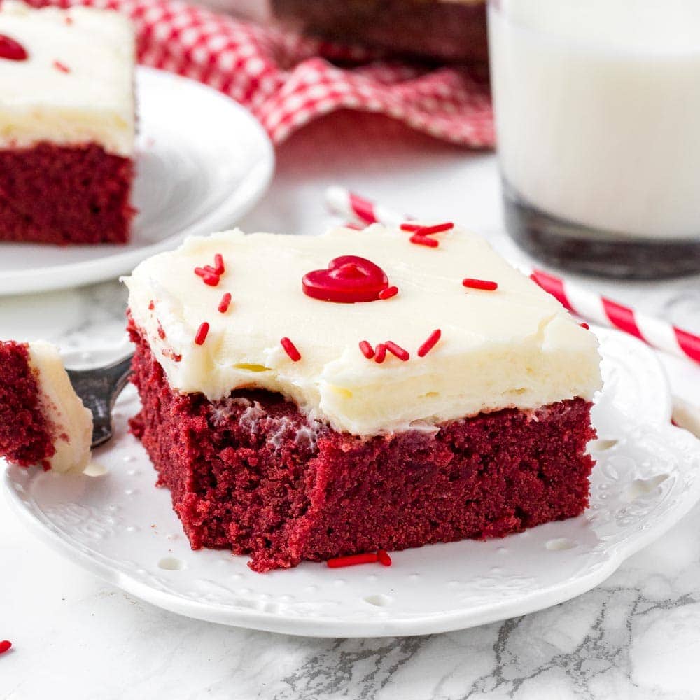 These easy red velvet brownies are extra fudgy with the perfect red velvet flavor and bright red color. Topped with cream cheese frosting - they're the perfect brownie recipe.