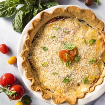 Pie dish filled with Baked Tomato Pie