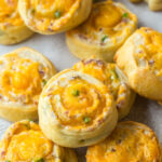 Plate filled with bacon cheddar jalapeno pinwheels