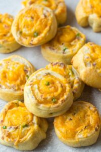 Plate filled with bacon cheddar jalapeno pinwheels