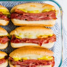 An overhead image of sub sandwiches in a pan