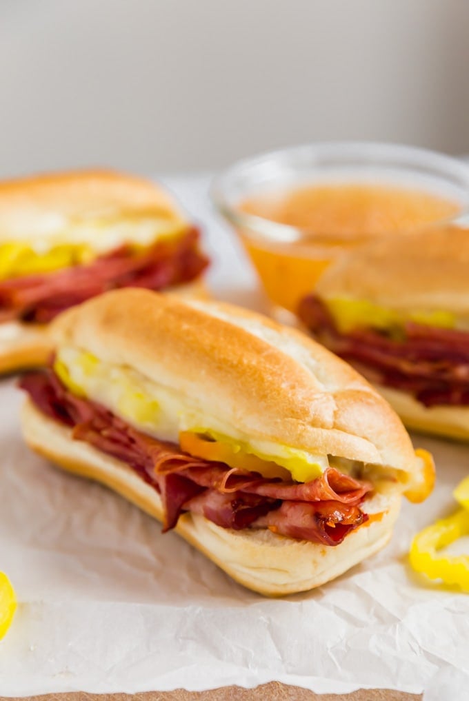 Italian sub sandwiches with Italian dressing in the background