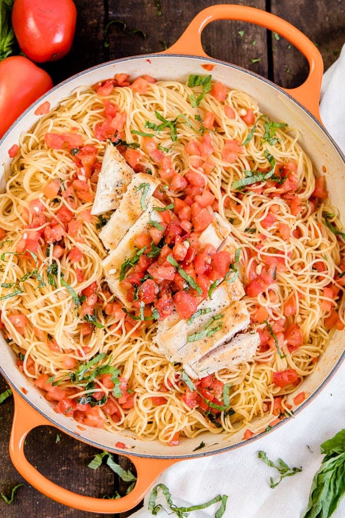 An overhead shot of a pan of Bruschetta Chicken Pasta - Easy Menu Planning