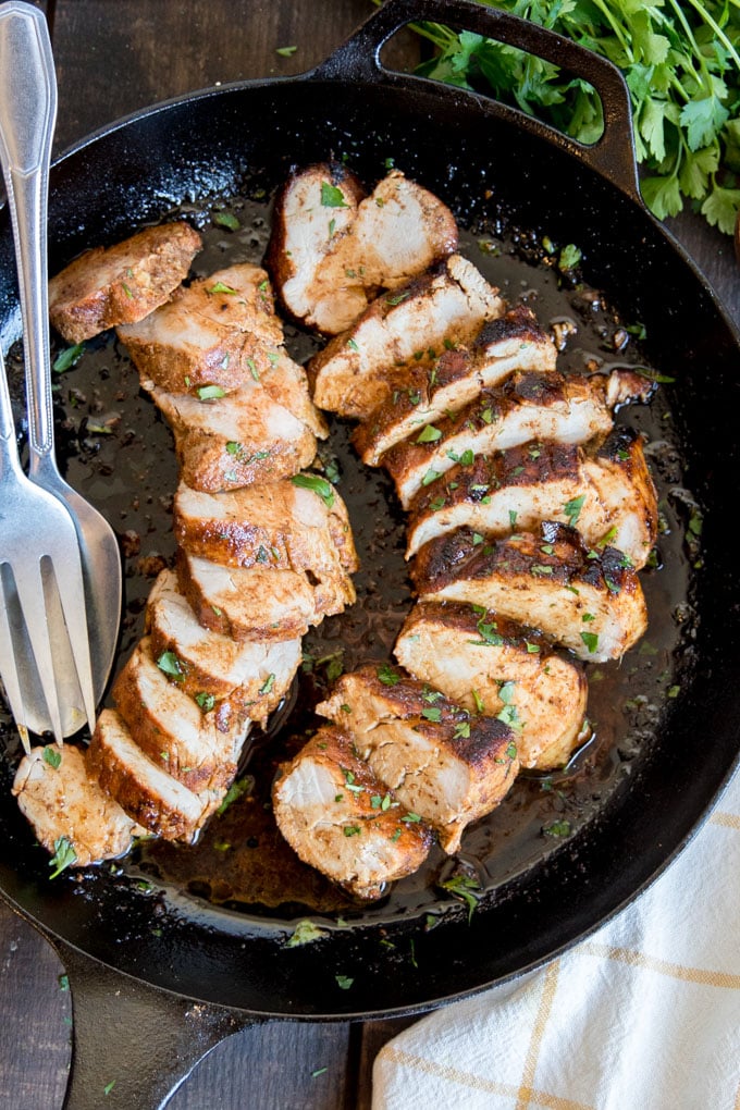 An overhead shot of Cajun Pork Tenderloin in a cast iron skillet.