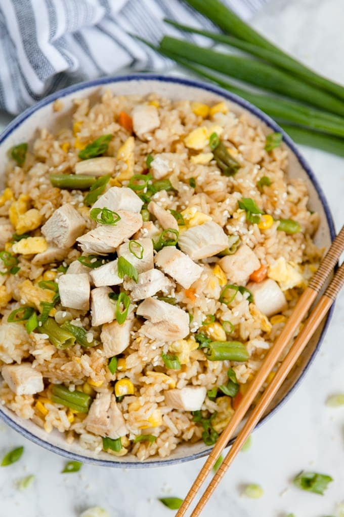Homemade Easy Chicken Fried Rice is simple, and so much better than take-out! This simple dinner is made with just a few ingredients and packed with flavor! overhead shot of chicken fried rice