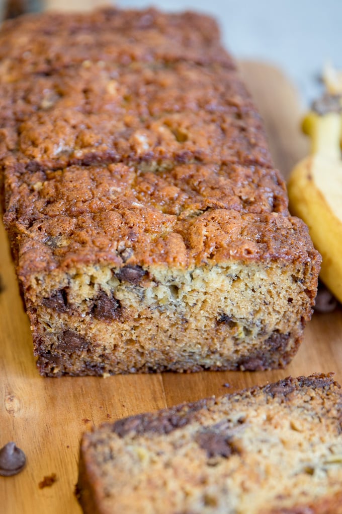 Banana Bread with chocolate chips, sliced on a cutting board