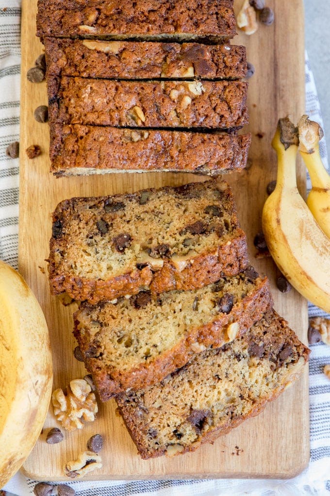 A loaf of chunky monkey banana bread sliced.