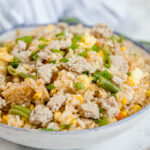 A dish is filled with Pork Fried Rice