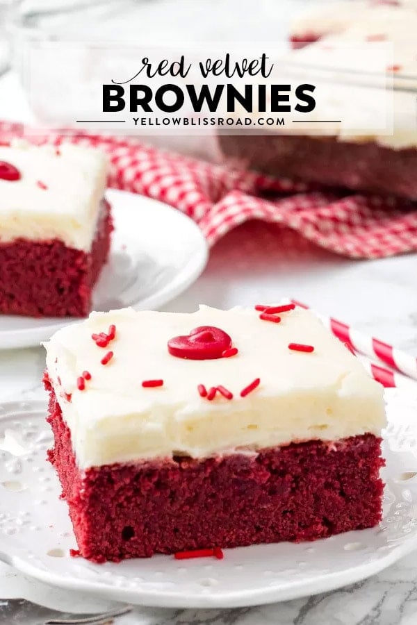 A Red Velvet Brownie with Cream Cheese Frosting on a plate. There is a title of the recipe on the photo.