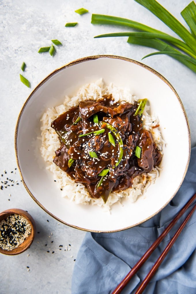 Slow Cooker Mongolian Beef in a bowl on a bed of rice