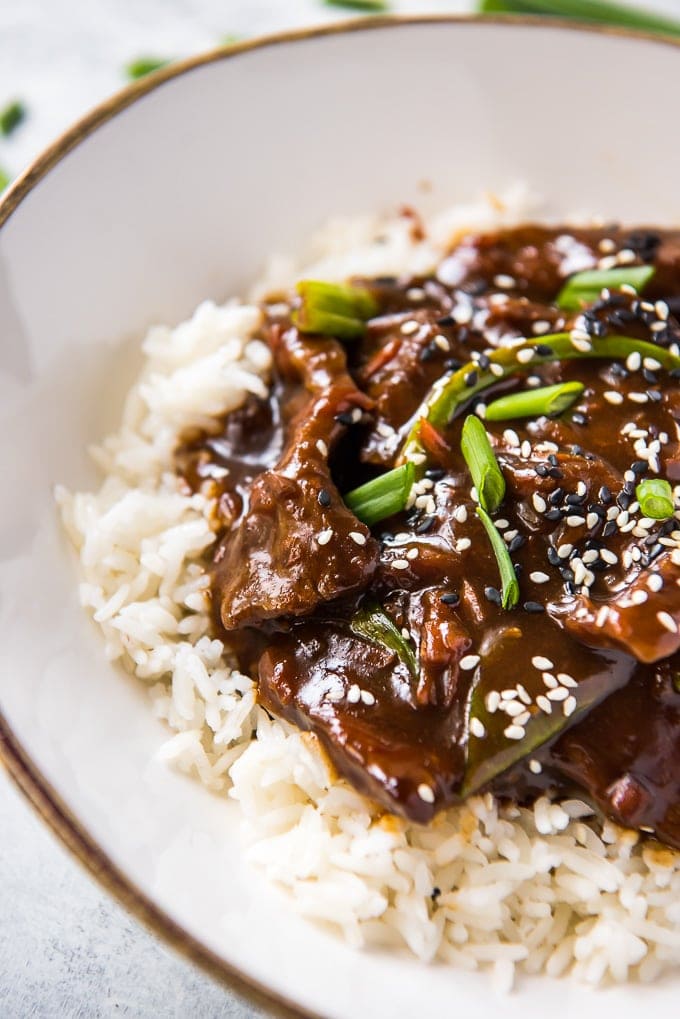 Close up of Slow Cooker Mongolian Beef on a bed of rice