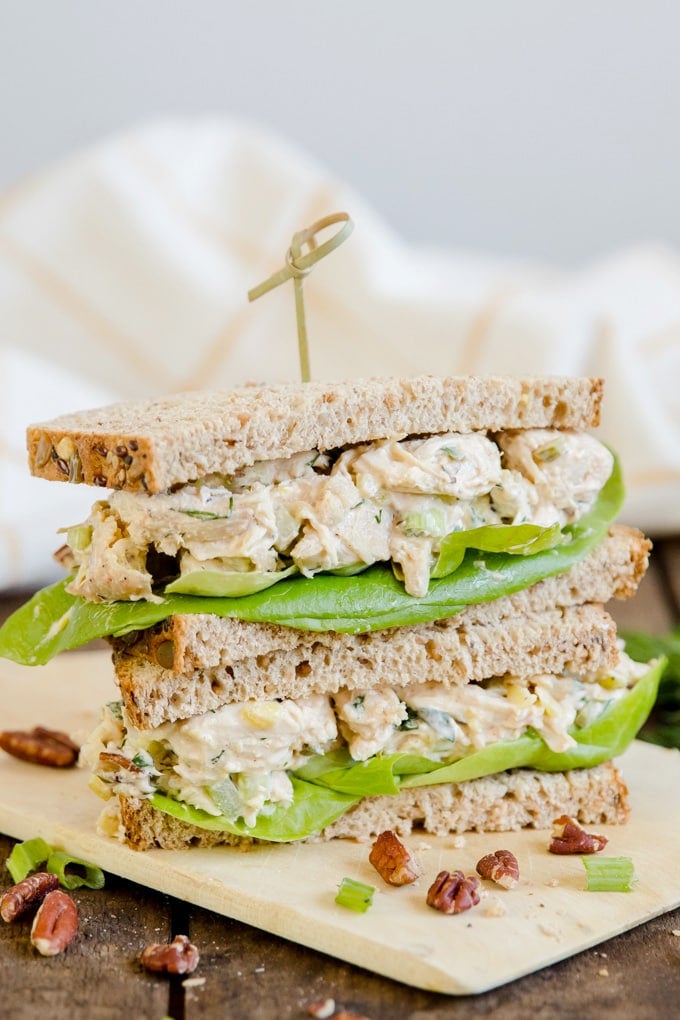 Two halves of a chicken salad sandwich stacked 