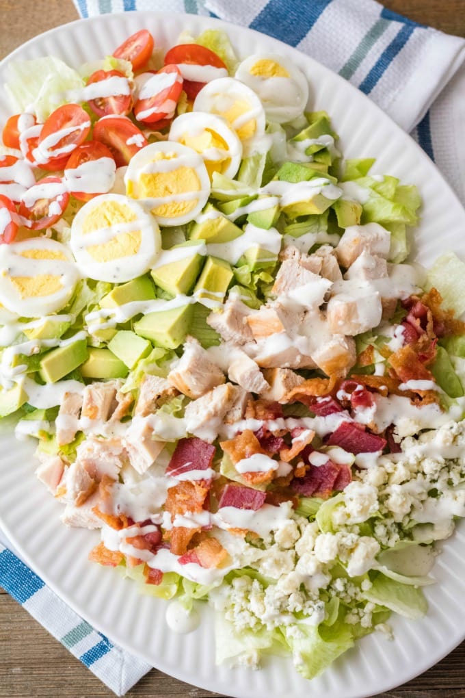 classic cobb salad drizzled with dressing