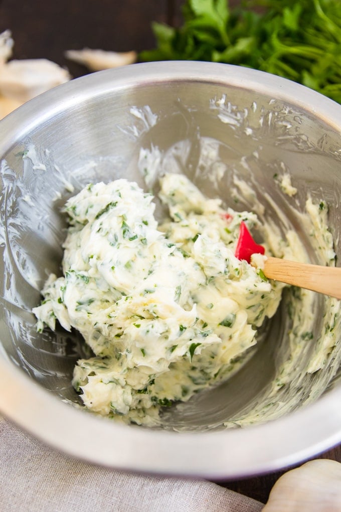 The best homemade garlic butter is easy to make with just 3 ingredients! It's perfect for everything from steak and seafood to potatoes and garlic bread. garlic butter mixture in a bowl