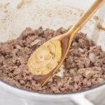 Pot with ground beef and spoon