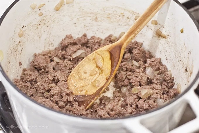 Pot with ground beef and spoon