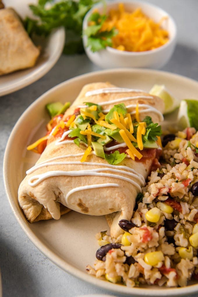 Chimichangas with rice and beans on a plate