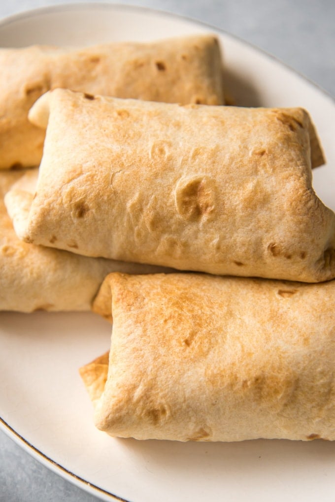 A platter of crispy baked chimichangas