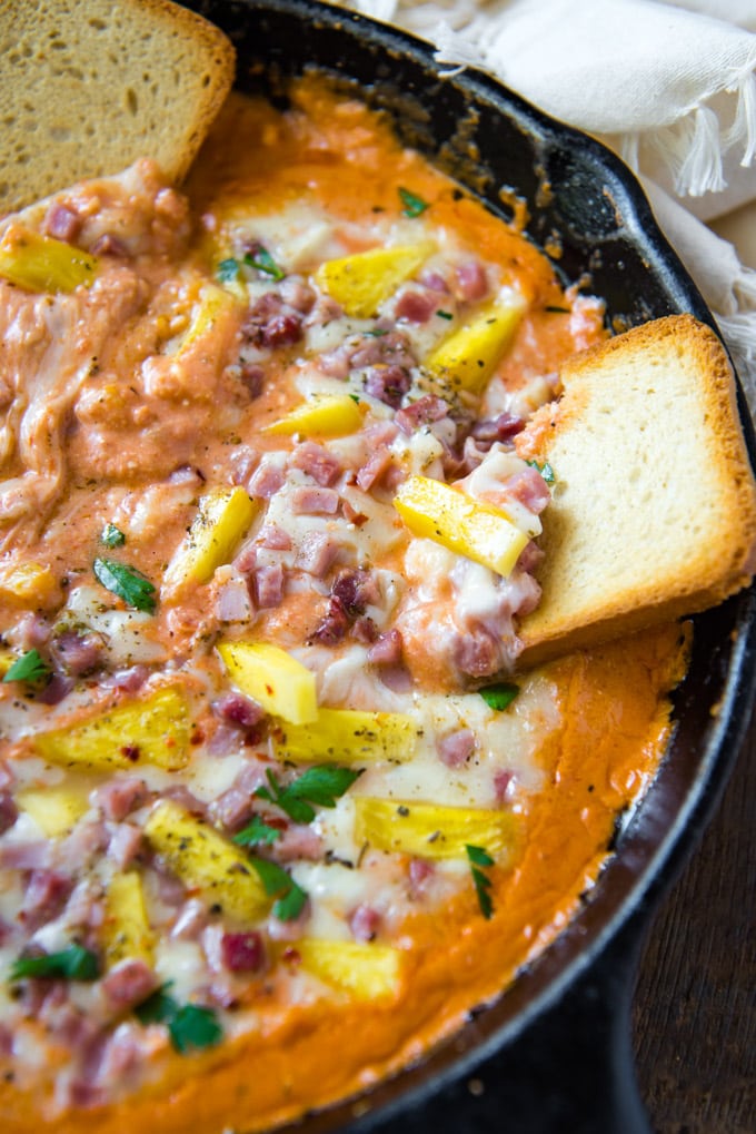 A pan filled with Hawaiian Pizza Dip and Bread