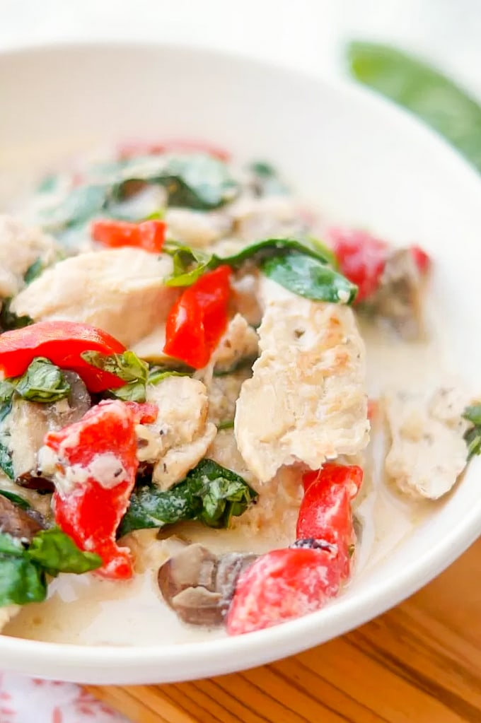 Instant Pot Chicken Florentine is a flavorful chicken dinner with vegetables in a creamy garlic parmesan sauce. Serve with pasta, rice or mashed potatoes. Chicken Florentine made in the instant pot