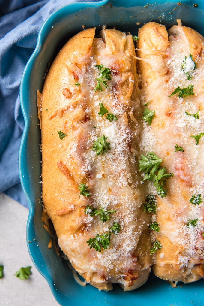 Meatball sub sandwiches in a casserole dish