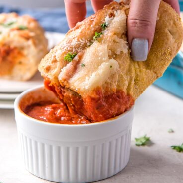 Social media image of Meatball Sub dipping into marinara sauce