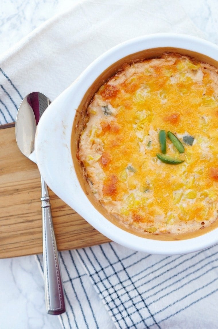 This Jalapeno Cheddar Corn Casserole is a delicious way to serve corn as a side dish with dinner! Filled with spicy jalapenos, creamy cheese and crisp corn. Cheddar Corn Casserole with Jalapenos