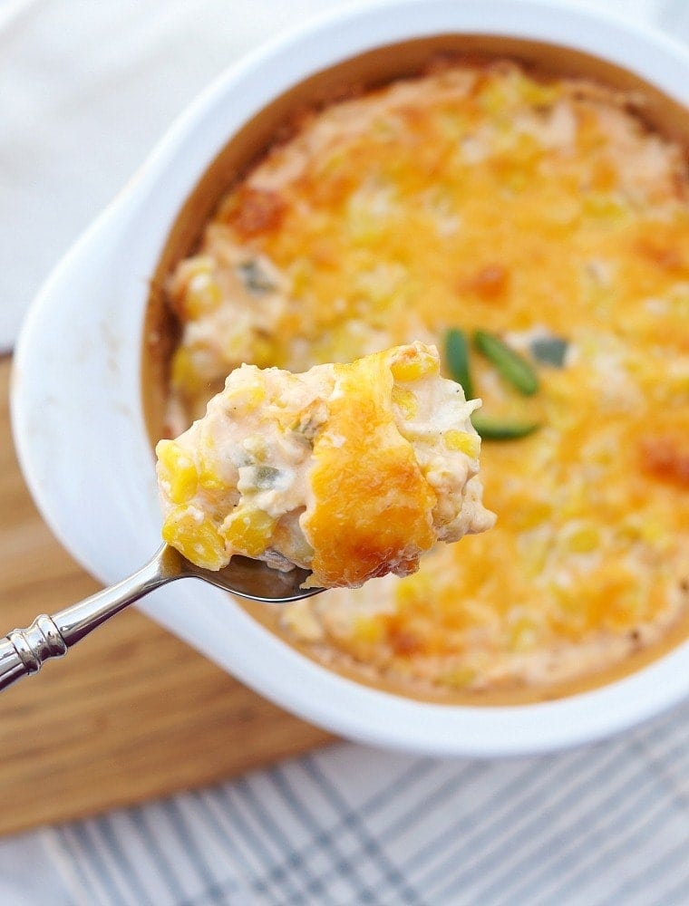 Corn Casserole with Cheddar Cheese and Jalapenos on a spoon