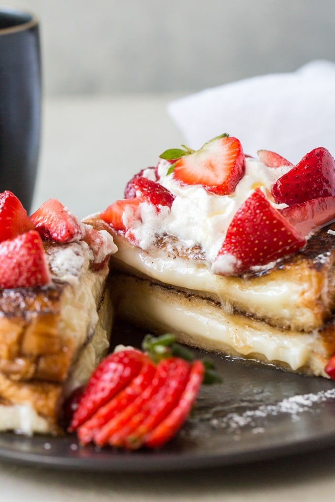 French Toast stuffed with sweet cream cheese and sliced in half.